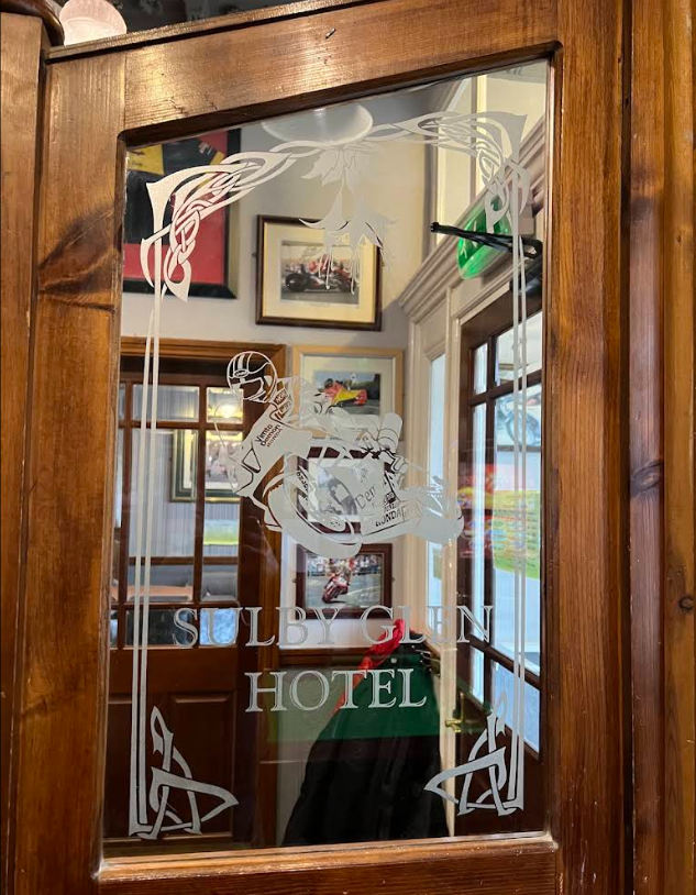 Vintage wooden door inside the Sulby Glen Hotel