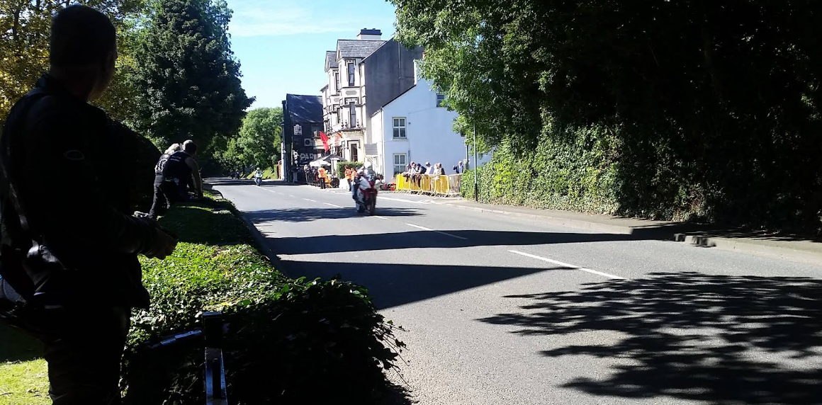 Motorcycles racing along the Sulby Glen straight outside the hotel