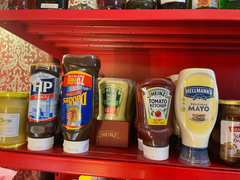 Shelf featuring local condiments and sauces