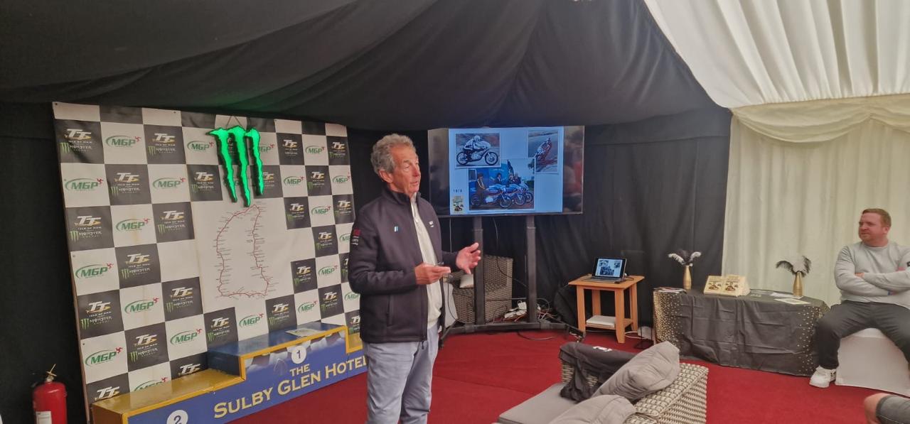 Host speaking at a TT corporate hospitality event